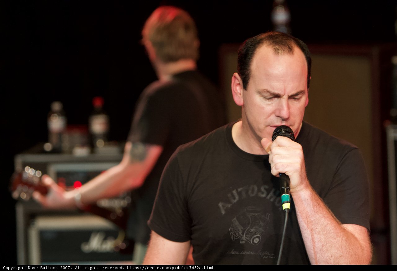 Black Shirted Singer with Microphone
