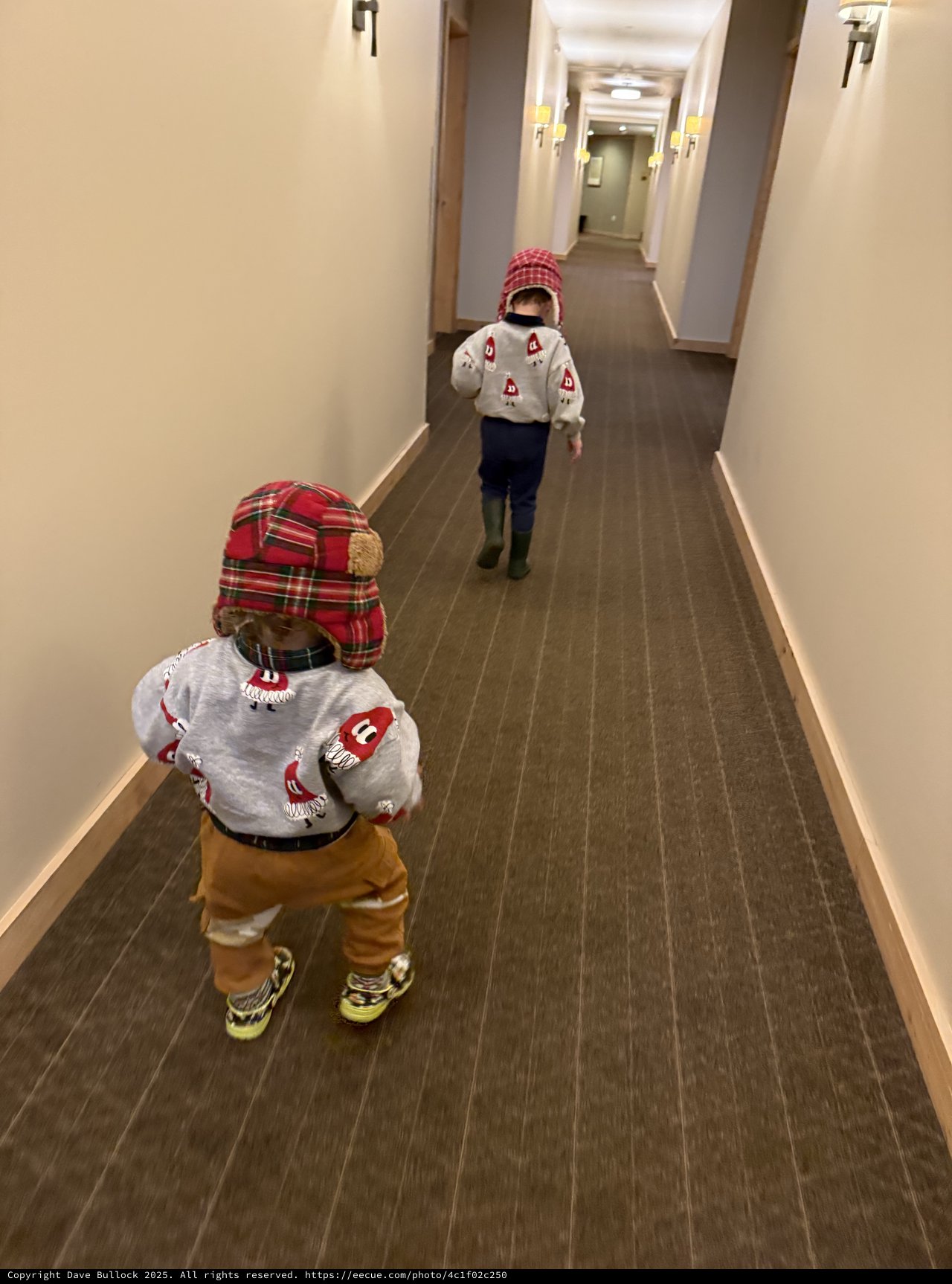 Two Little Explorers Marching Down Hotel Hallway