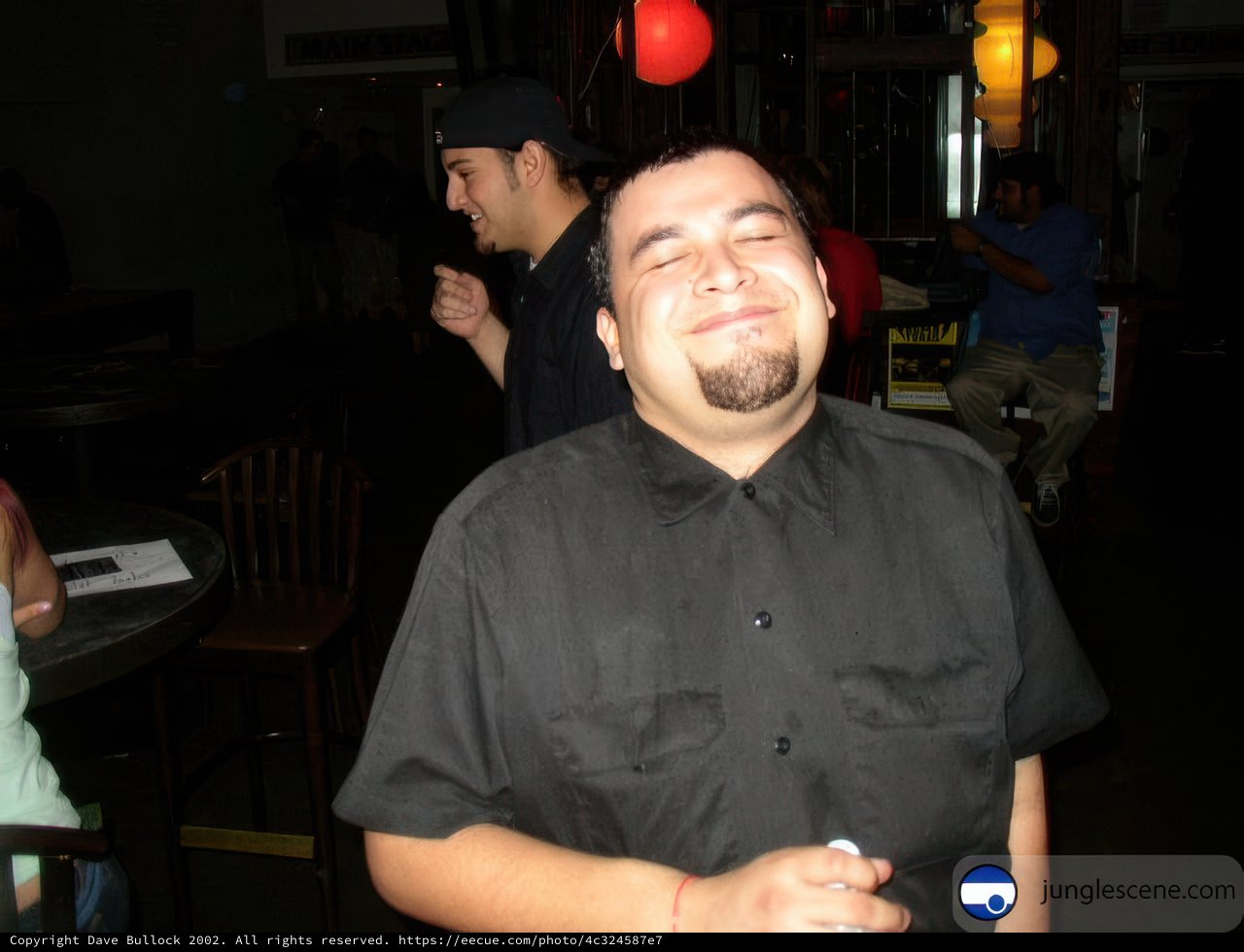 Smiling Man in Black Shirt