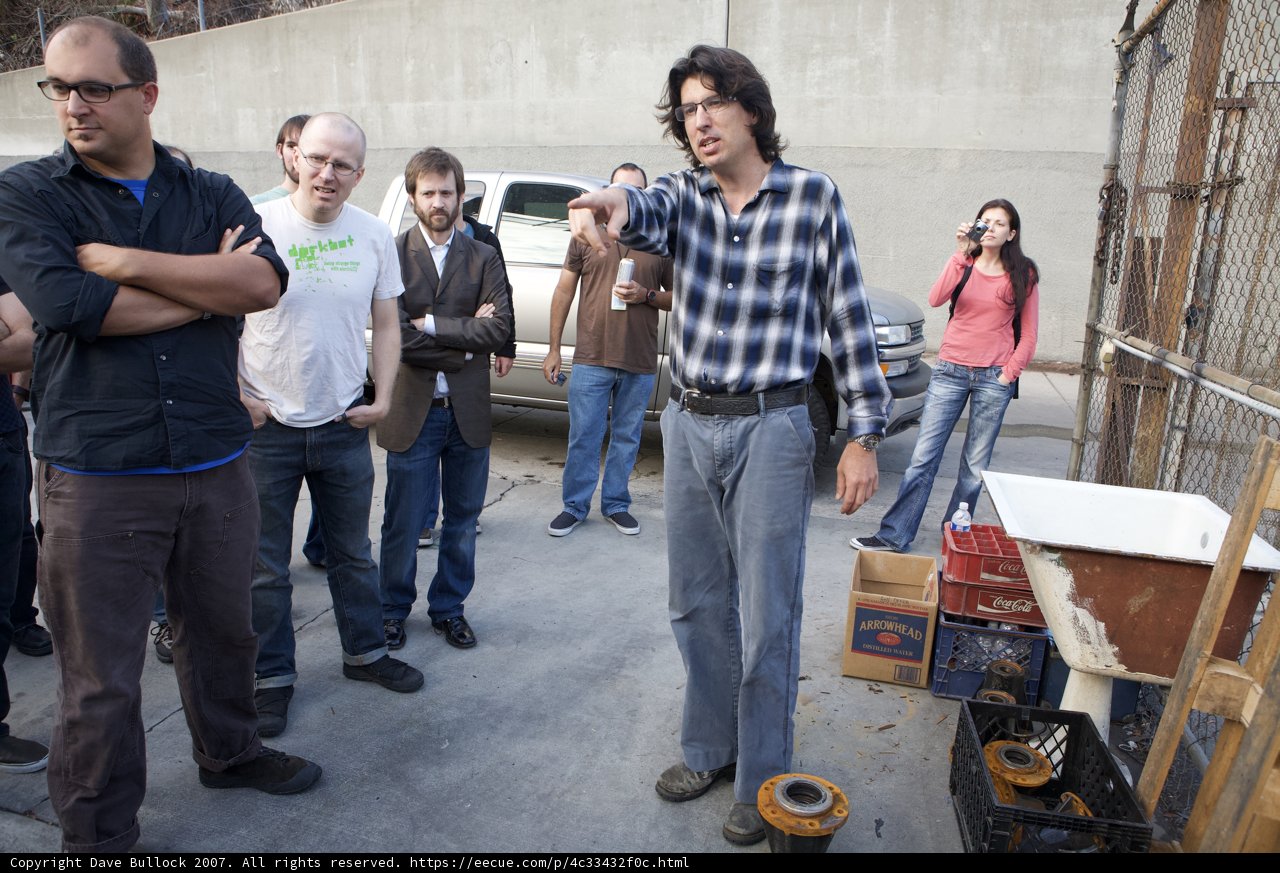 Group Examining Wooden Container