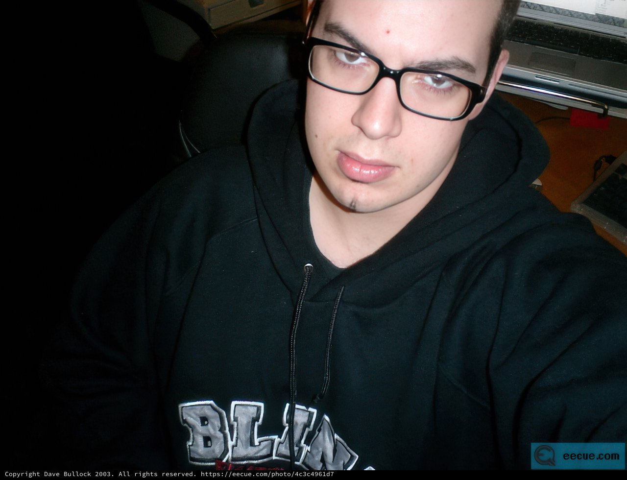 Dave B in Black Hoodie and Glasses