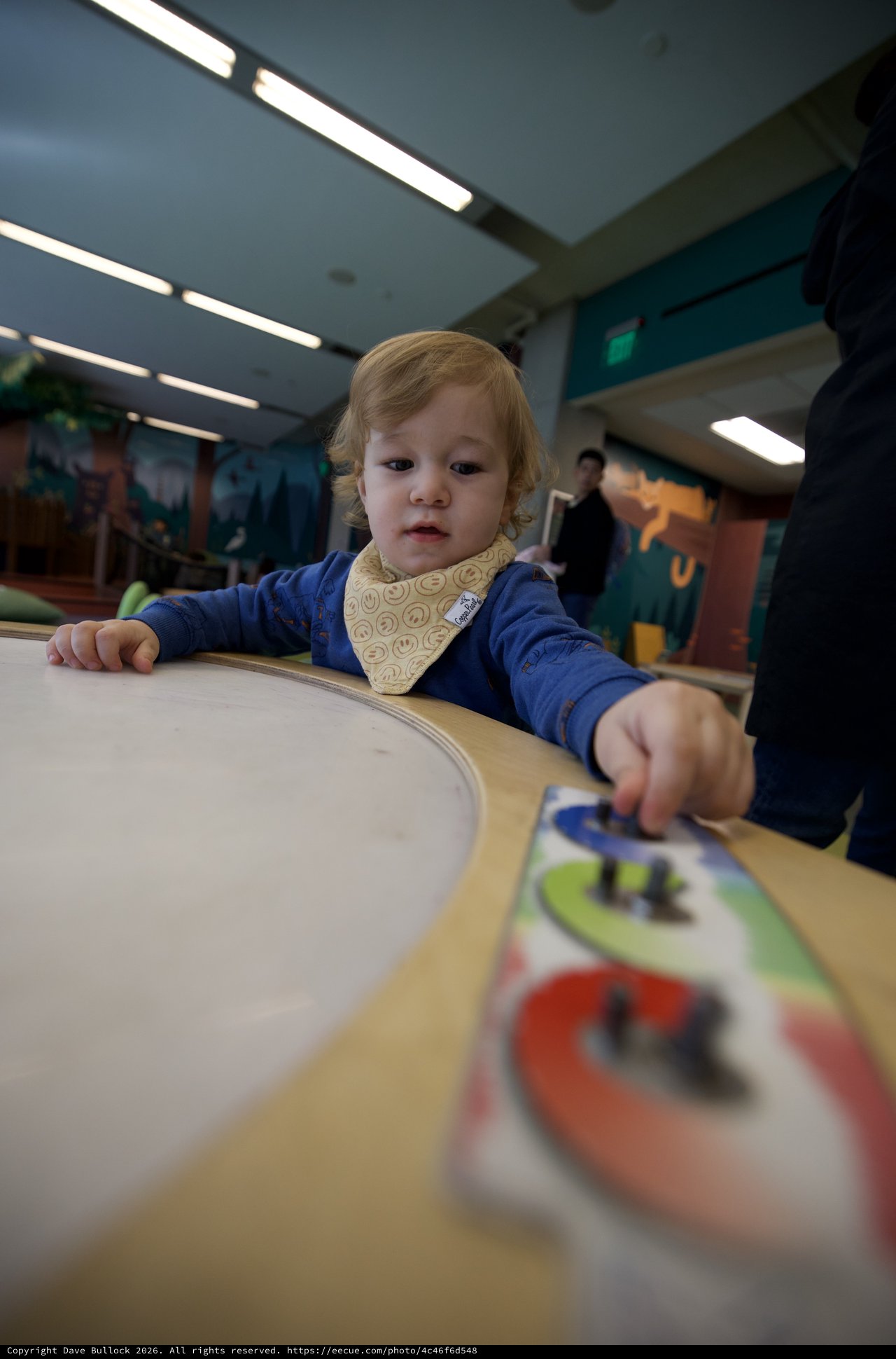 Toddler Engaged in Learning Activity at Children's Museum