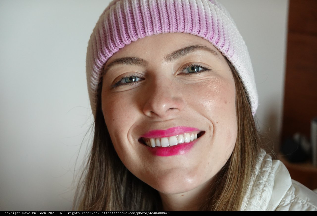 Woman with Pink Beanie Bright Smile Portrait
