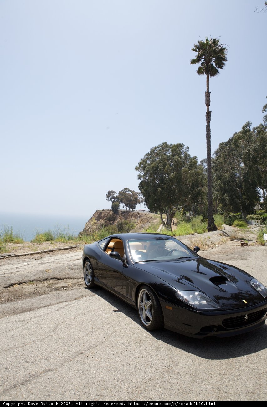 Parked Black Sports Car with Alloy Wheels