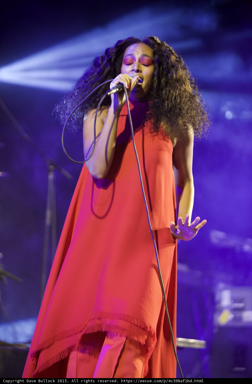 Solange Eyes Closed Hand Extended Full Body Red Dress