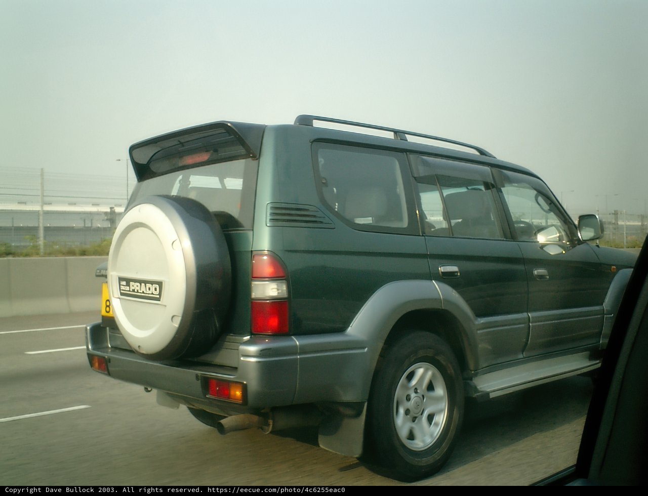 Green SUV tearing up the highway