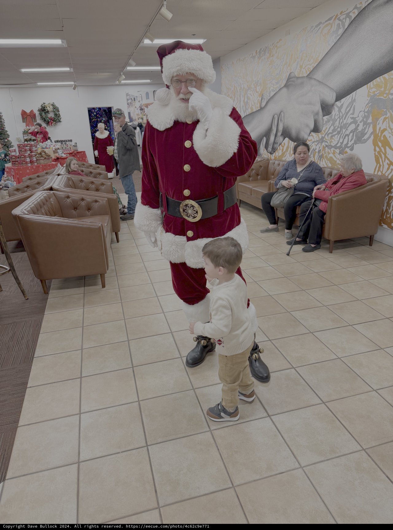 Santa Meets Young Child at Christmas Event