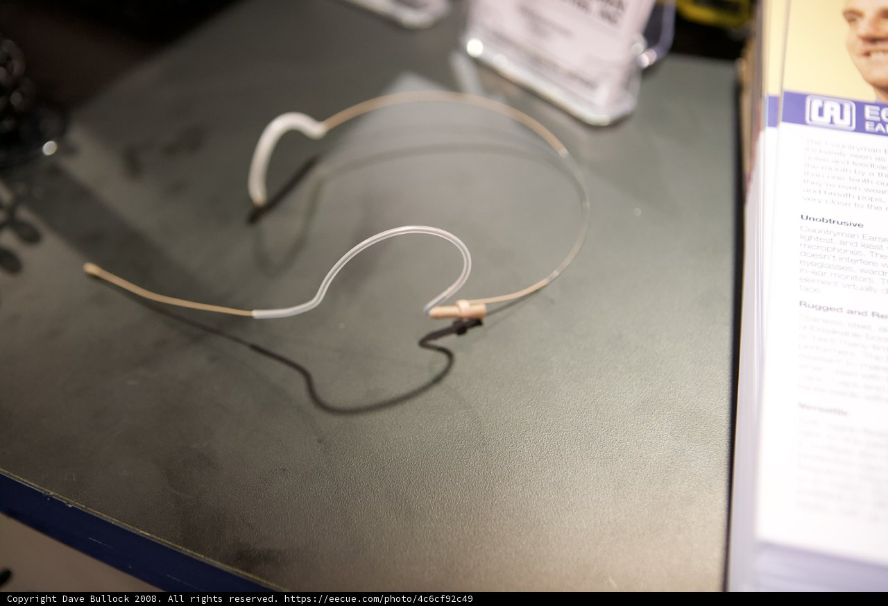 Ear buds resting on a wooden table
