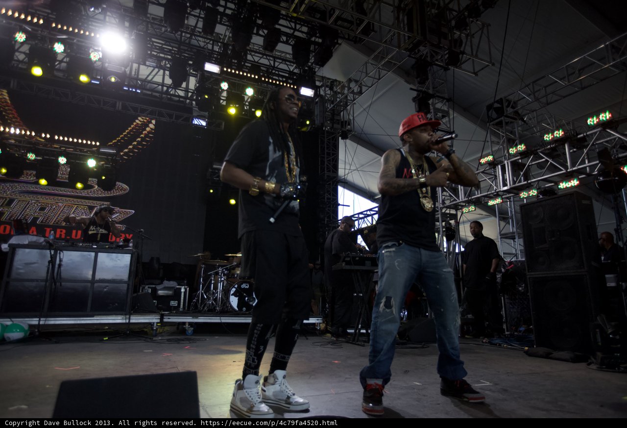 Two Men Rock the Stage with Music and Microphone