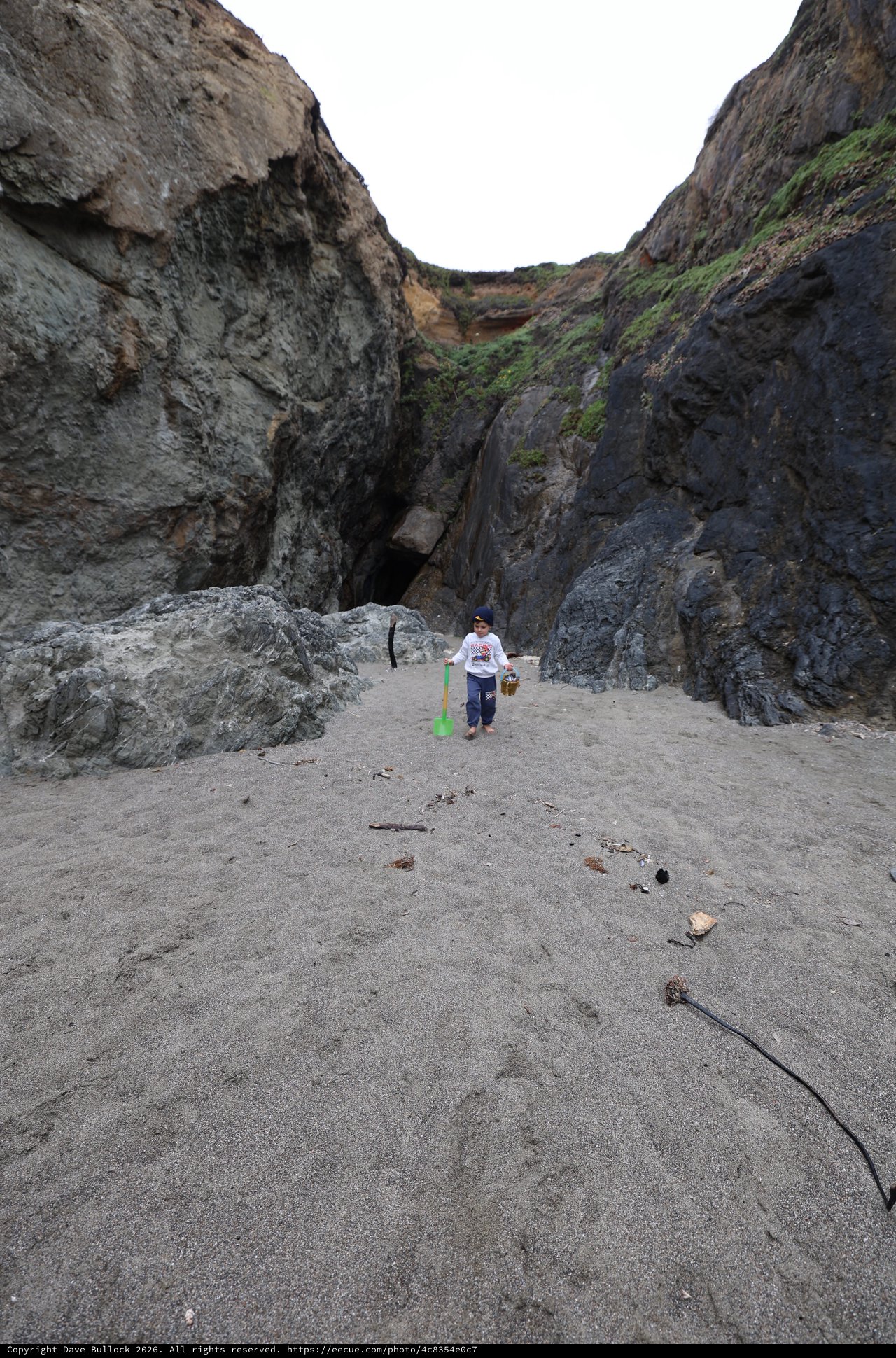 Young Explorer in a Rocky Coastal Canyon