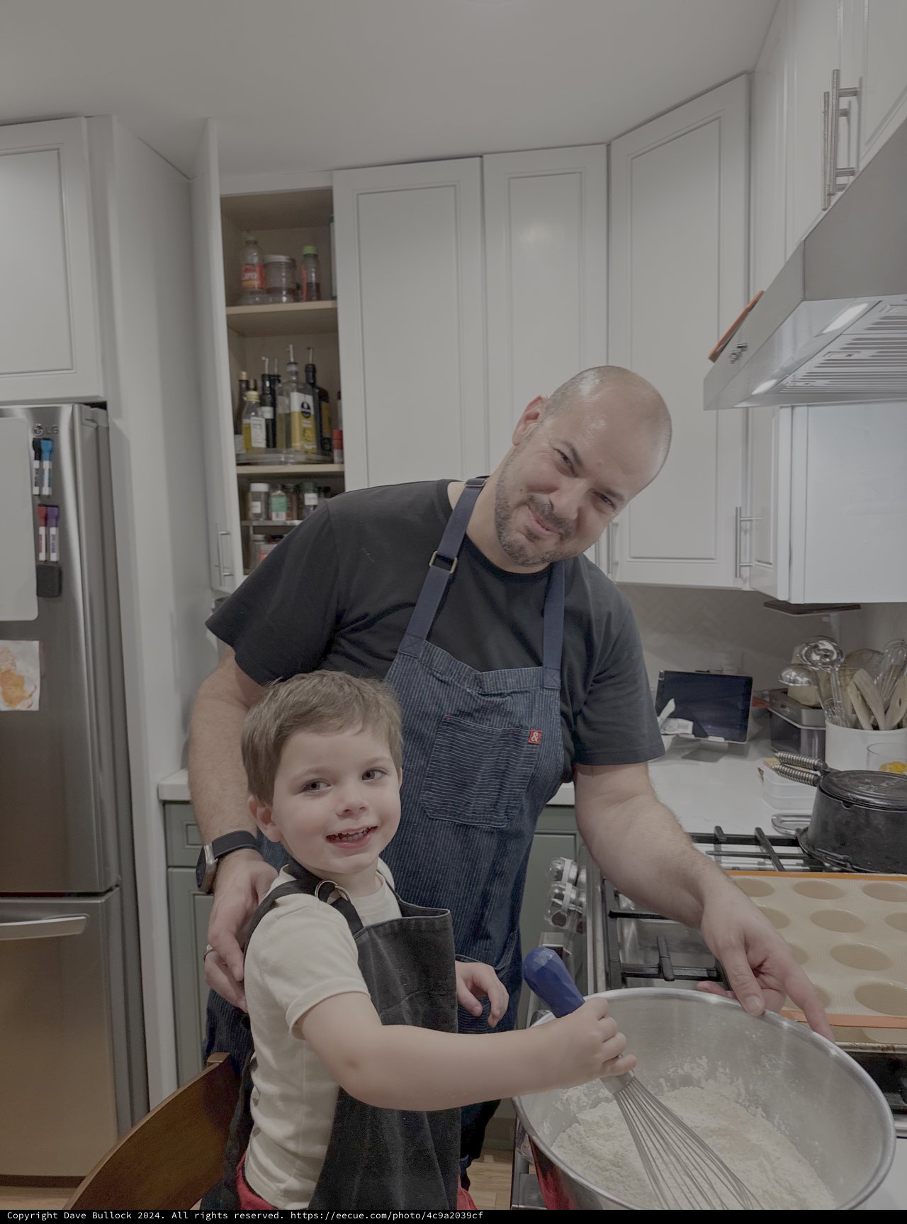 Father and Son Cooking Together in Kitchen