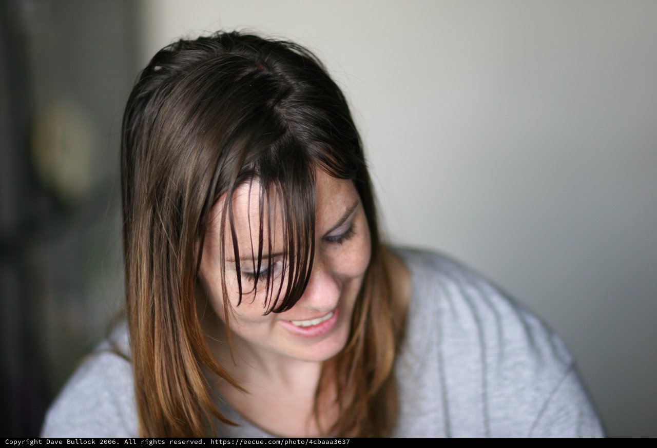 Candid Smile Behind Dark Flowing Wet Hair