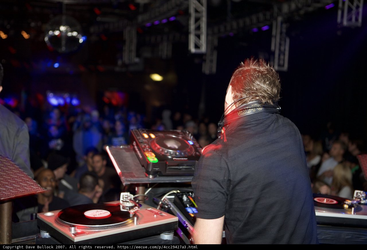 Nightclub DJ working the crowd