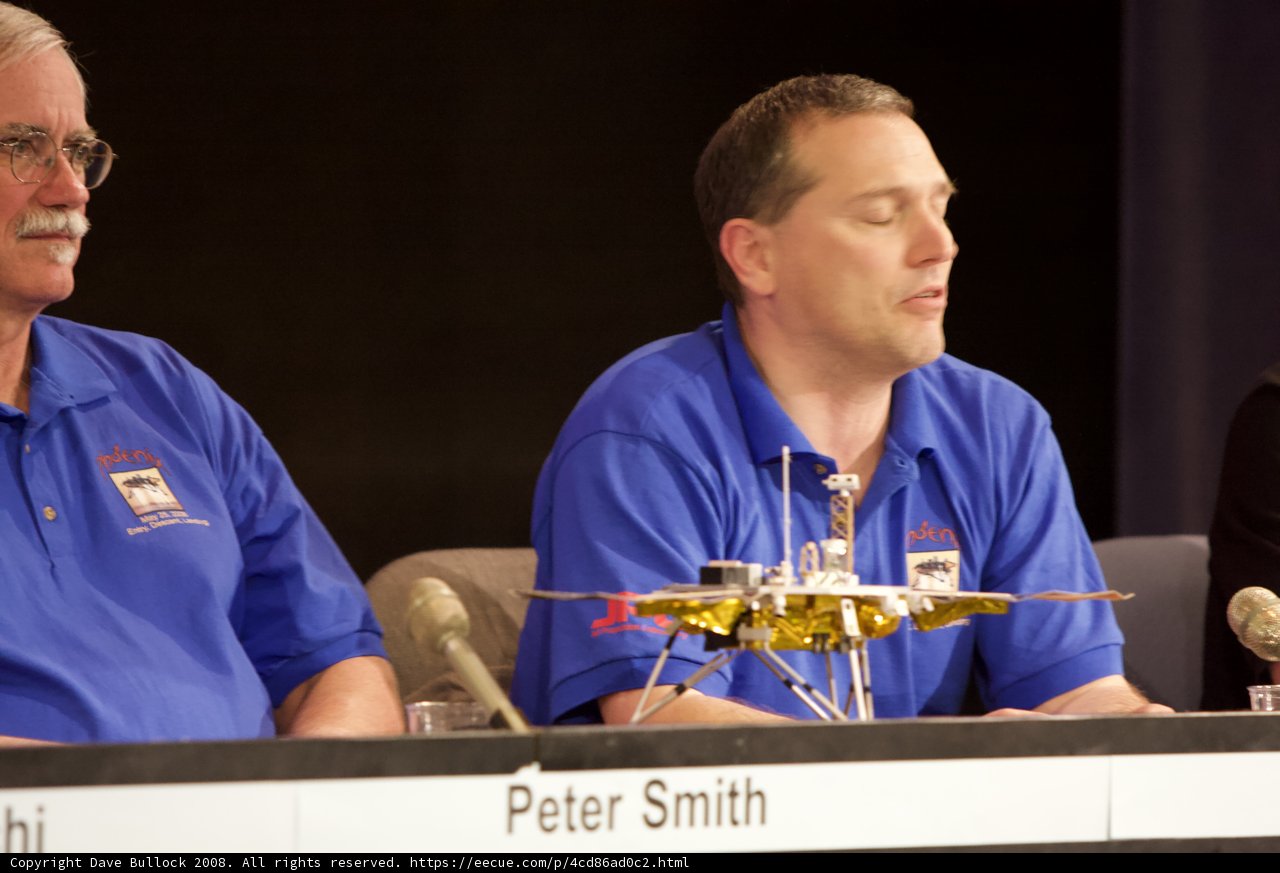 Phoenix Landing Press Conference with Two Men and Microphones