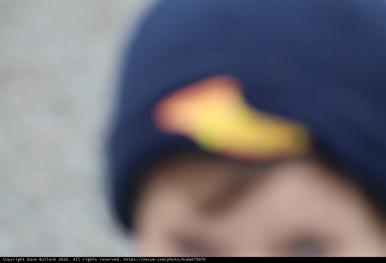 Blurred Close-Up of Child in Navy Baseball Cap