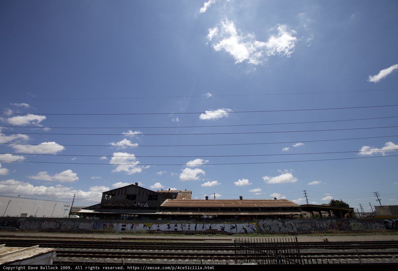 City Train Passes by Building