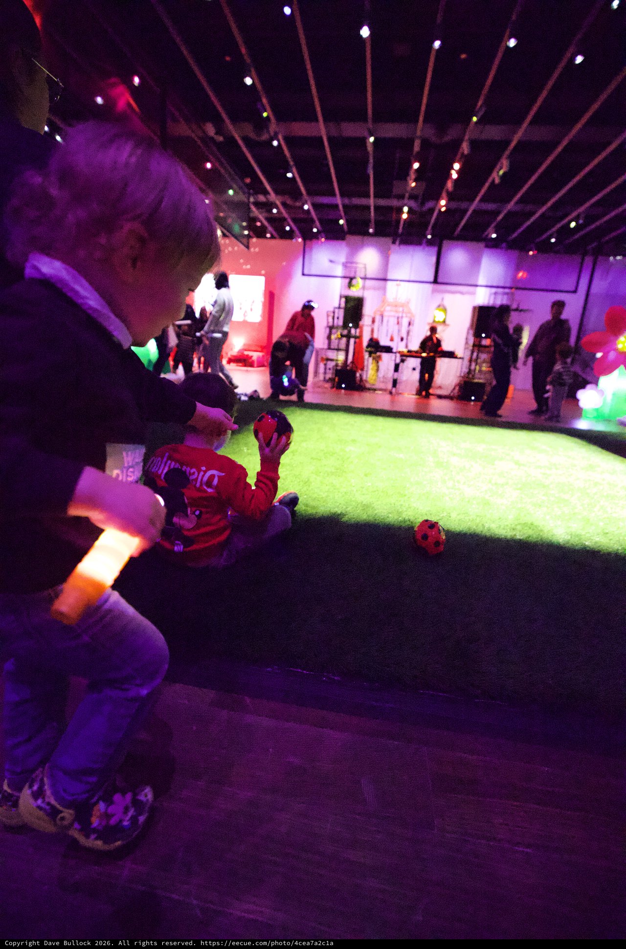 Children Playing at Baby Rave Event with Neon Lighting