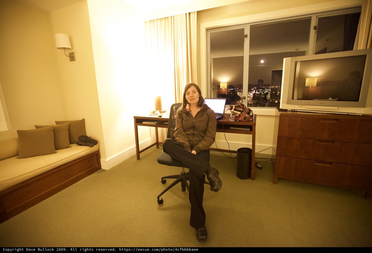 Woman Relaxing in San Francisco Hotel Room at Night