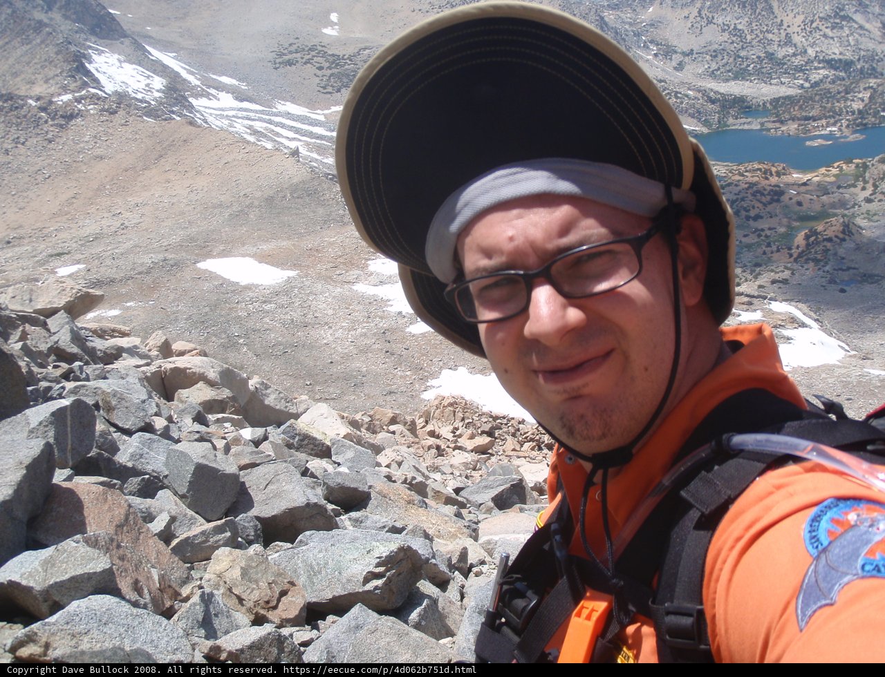 Hat-clad adventurer explores the mountain range