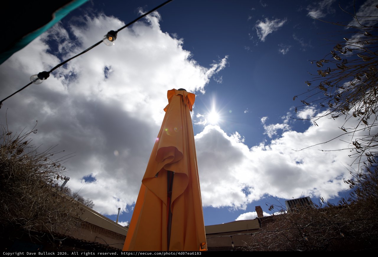 Orange Tower Monument Under Dramatic Desert Sky
