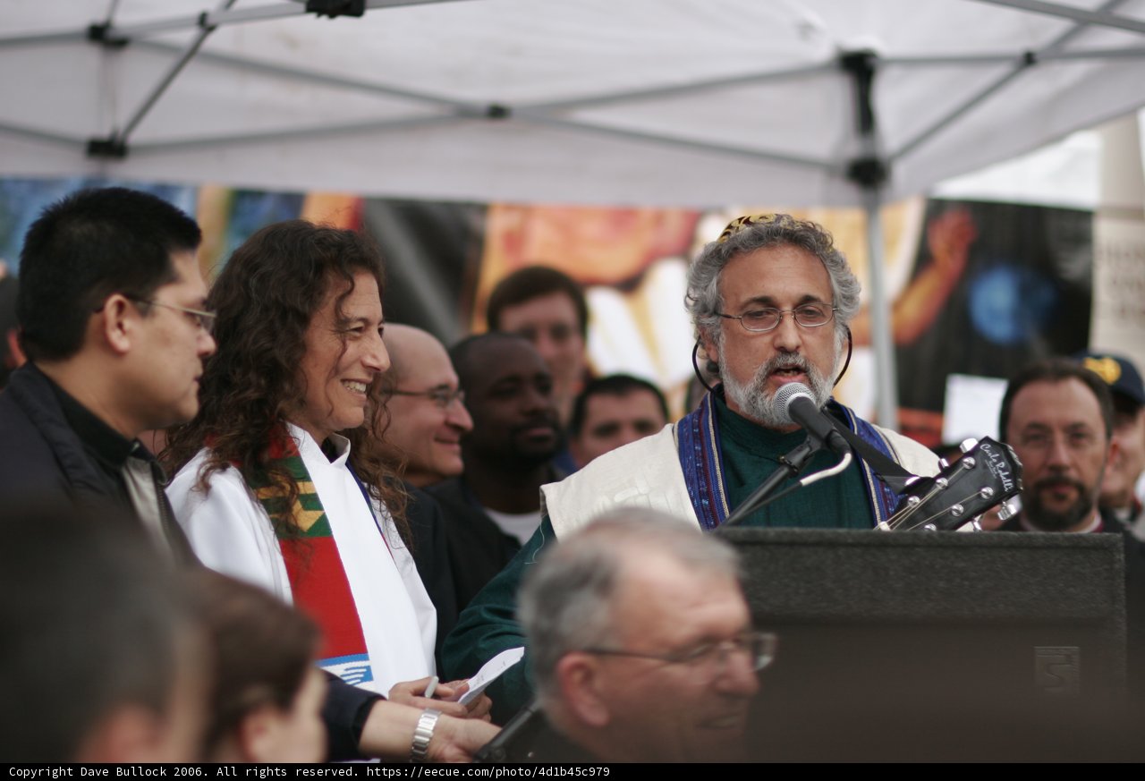 Man with a Microphone Entertaining a Crowd
