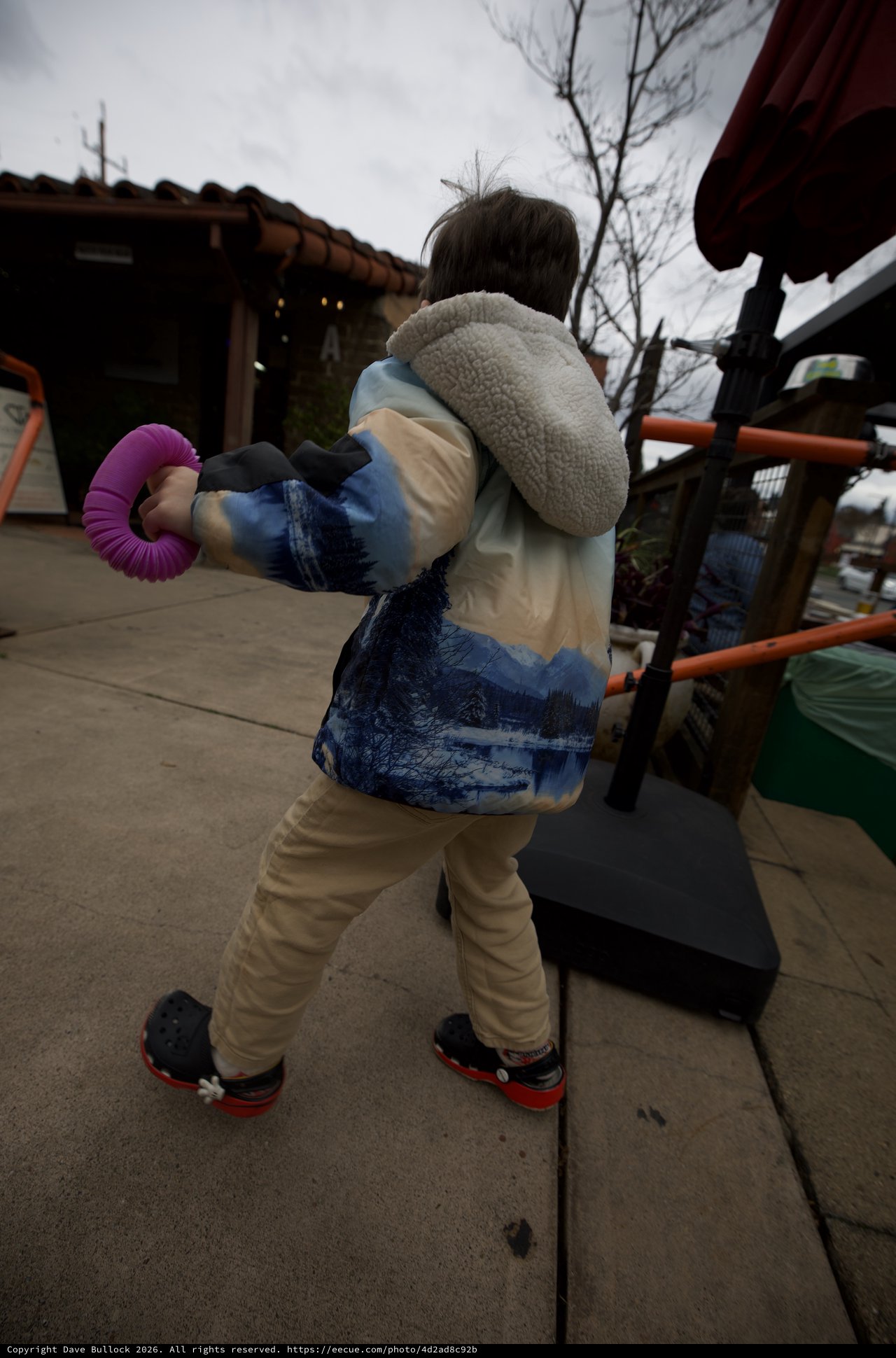 Child Playing on Outdoor Playground Equipment