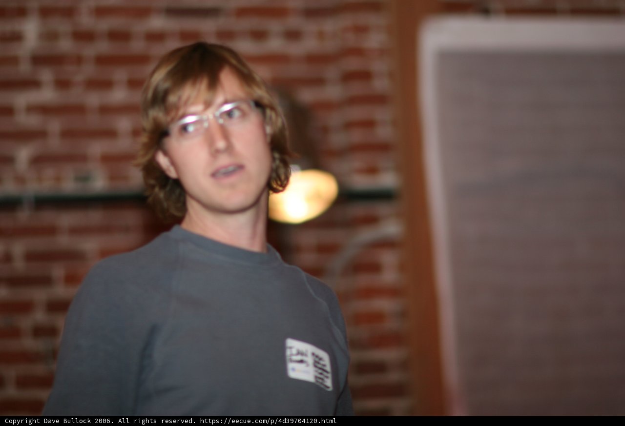 The Glasses-Wearing Man in Gray