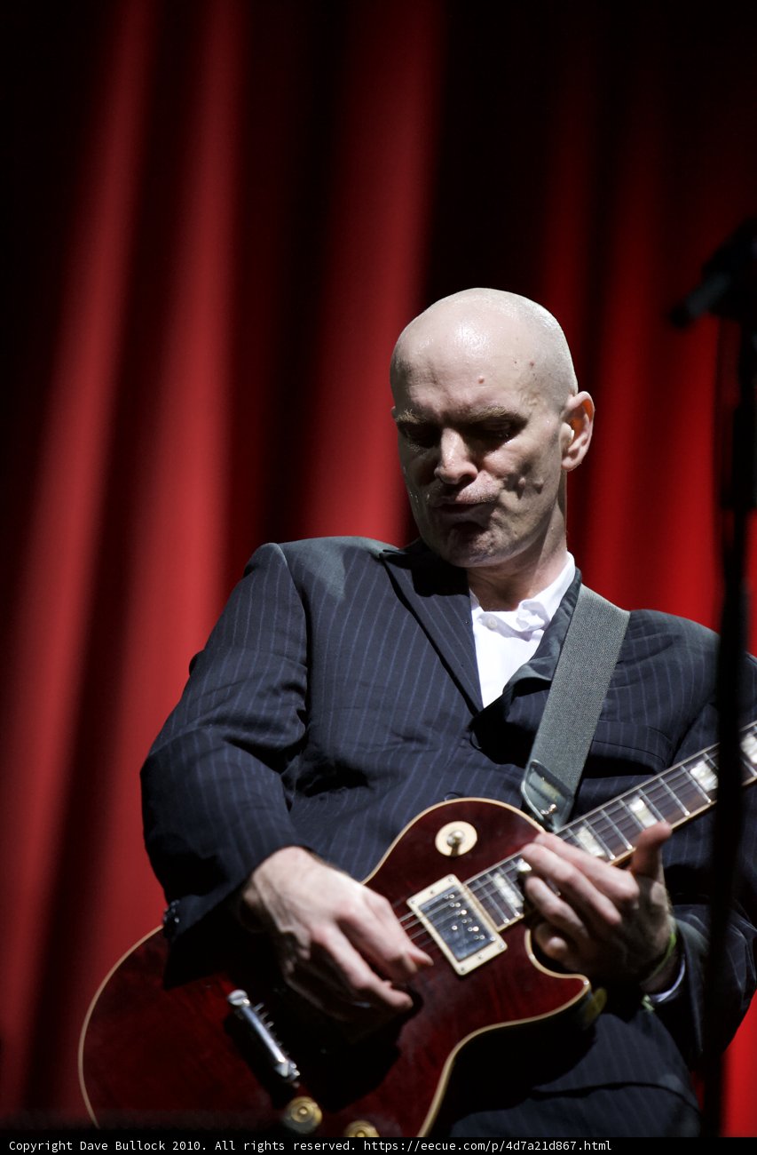 Bald Man in a Suit Shreds on Electric Guitar at Coachella