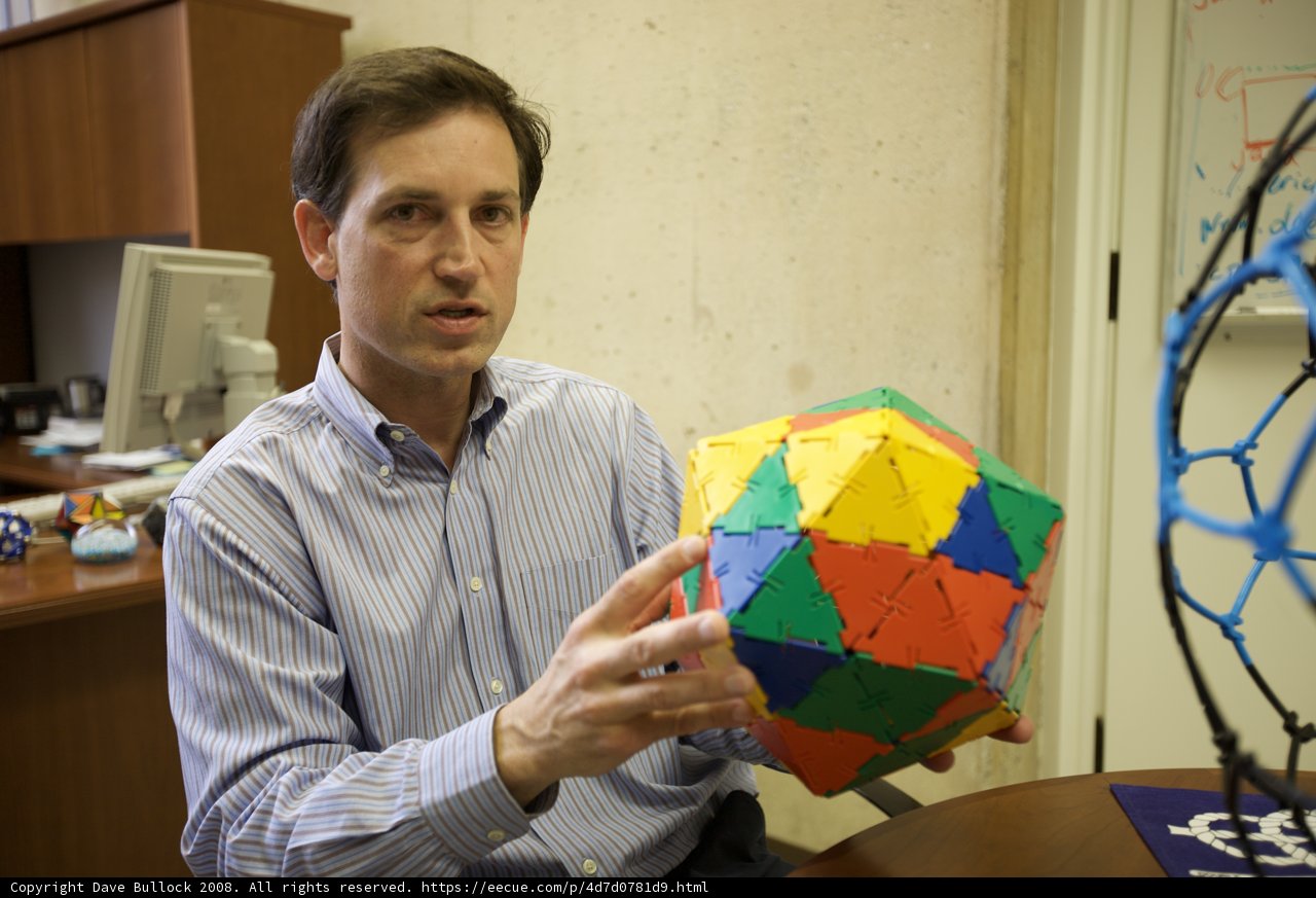 Colorful Sphere in the Hands of a Modern Man