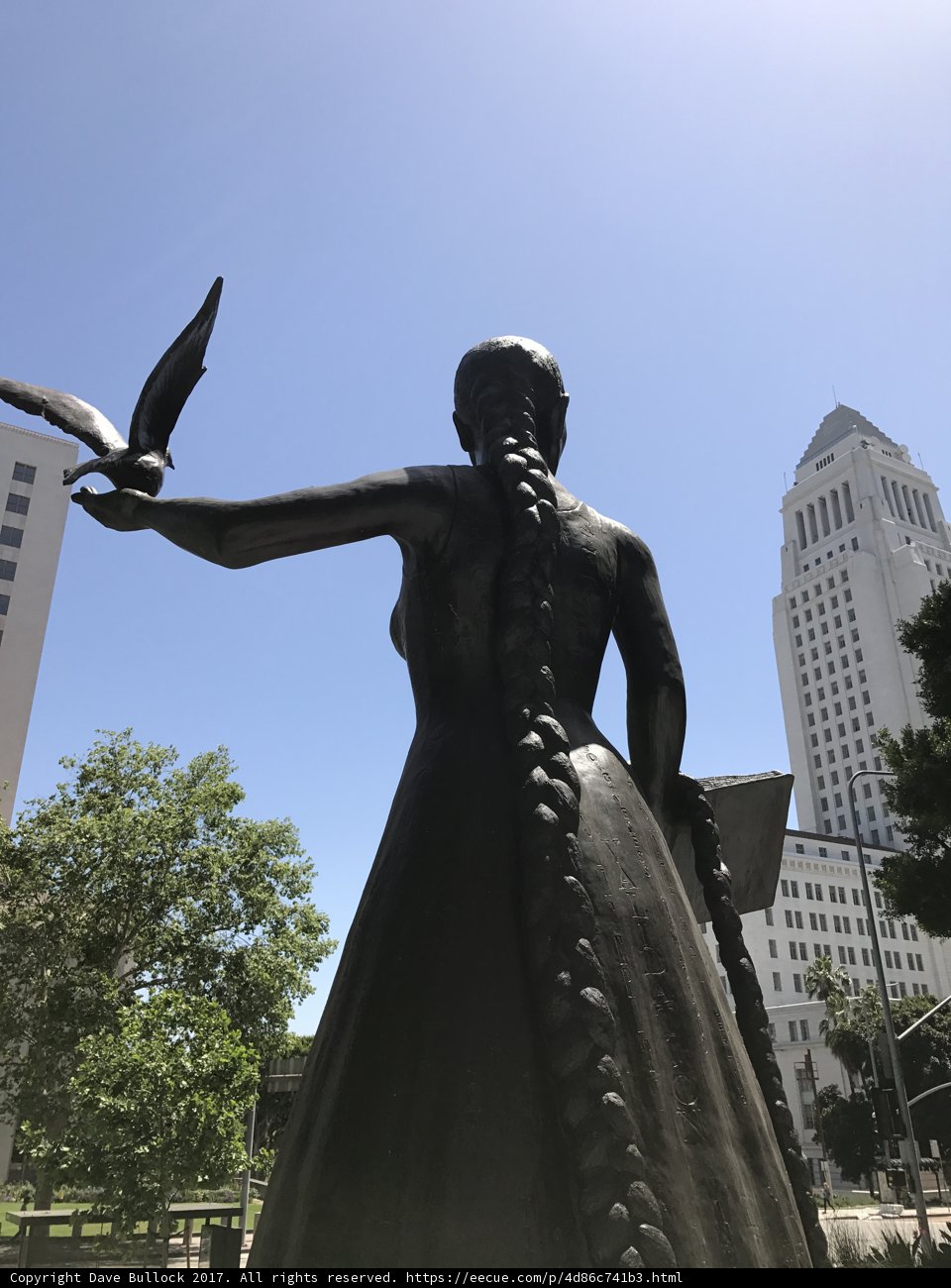 Statue of woman holding bird in Metropolis