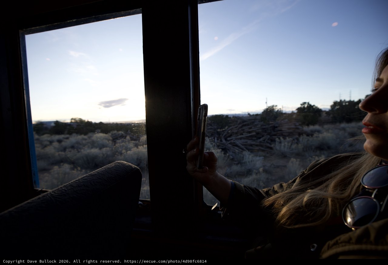 Woman Gazing at Desert Sunset Through Vehicle Window