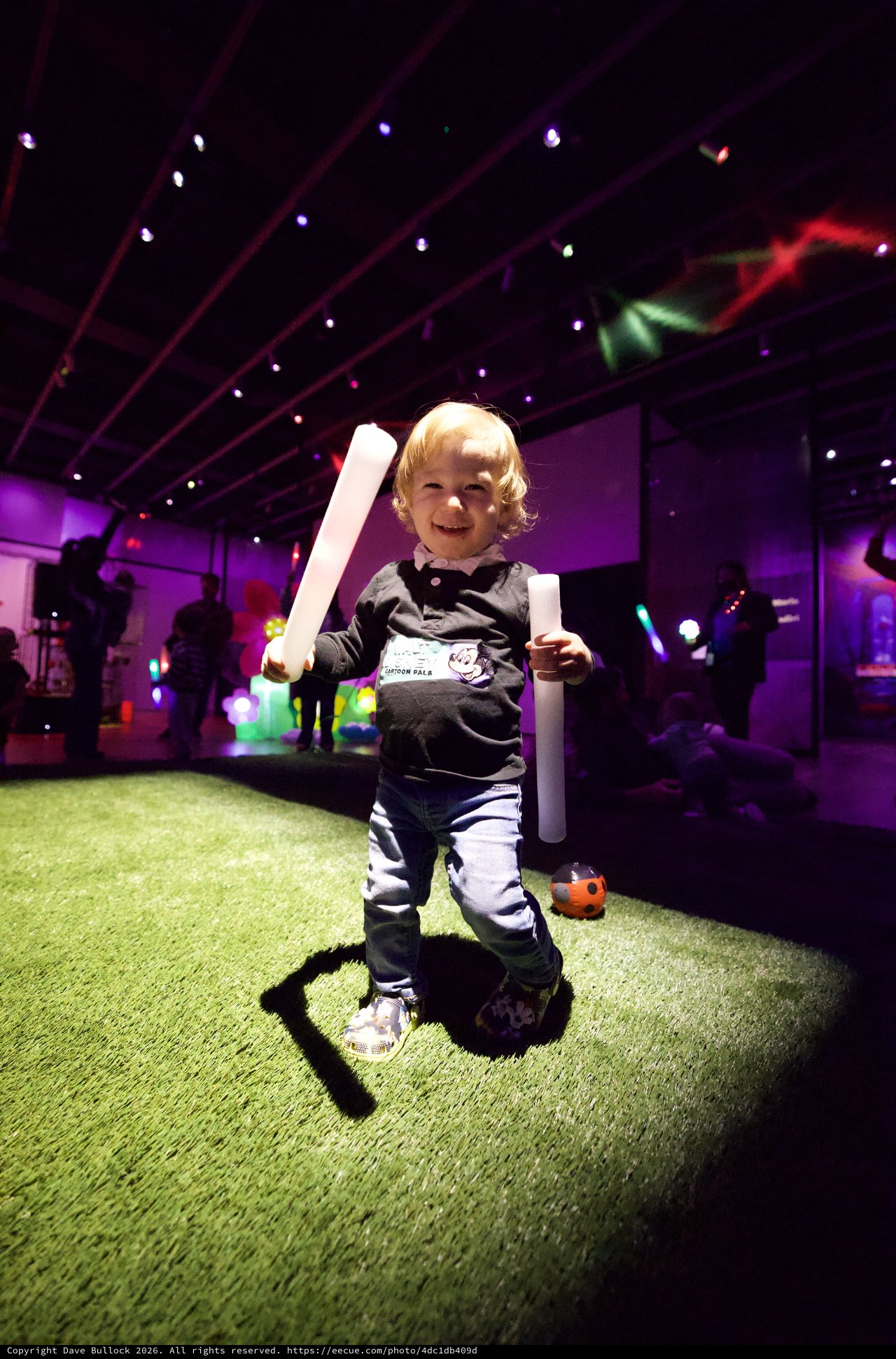 Toddler with Glow Sticks at Baby Rave Event
