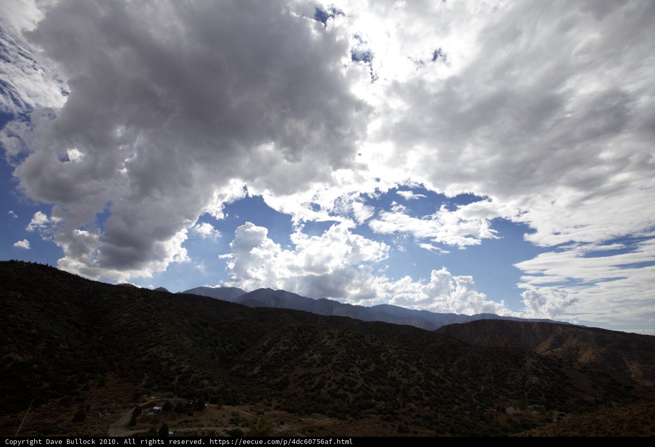 Majestic Mountains and Billowy Clouds