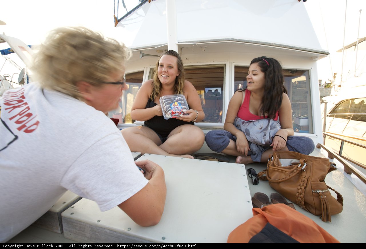 Three Happy Women Enjoying a Ride on a Yacht