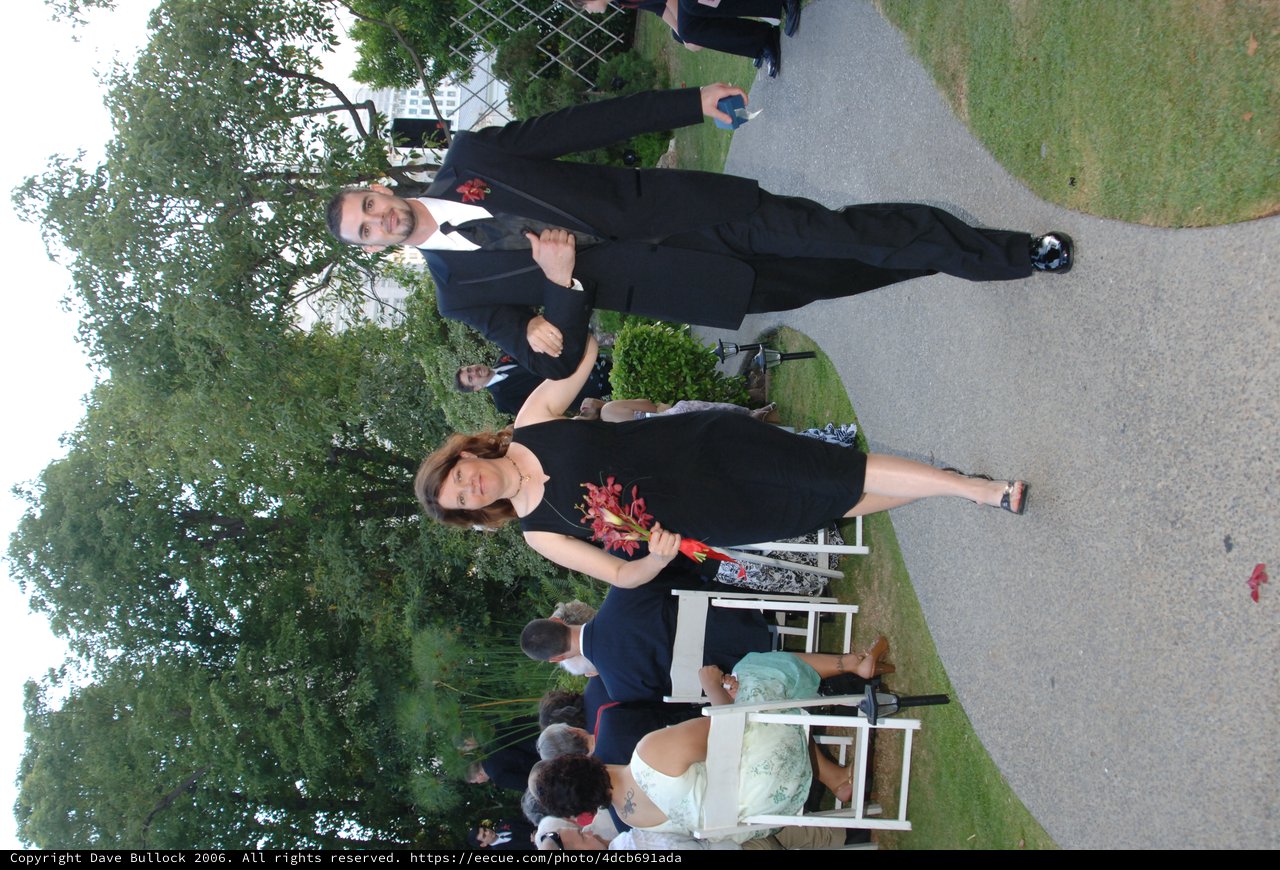 Elegant Couple Walks Down Wedding Aisle Together