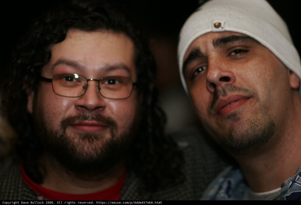 Two Men with Beards and Glasses Strike a Pose
