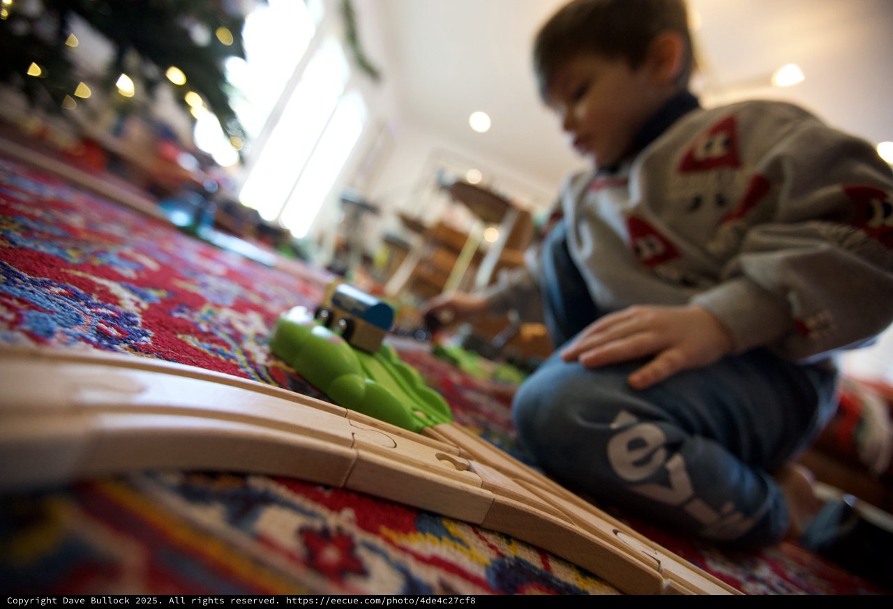 Child Playing with Train Set on Christmas Day