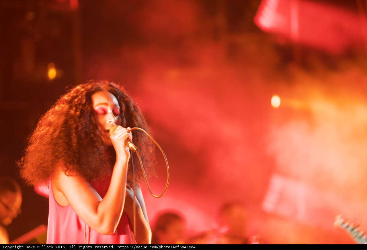 Solange Portrait Eyes Closed Band Background Red Pink
