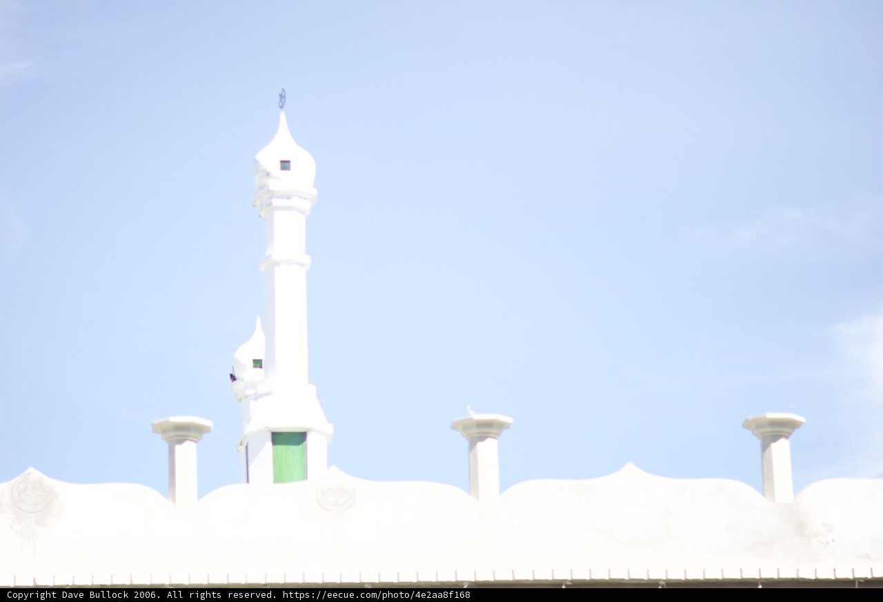 White Mosque Tower Reaching for the Blue Skies