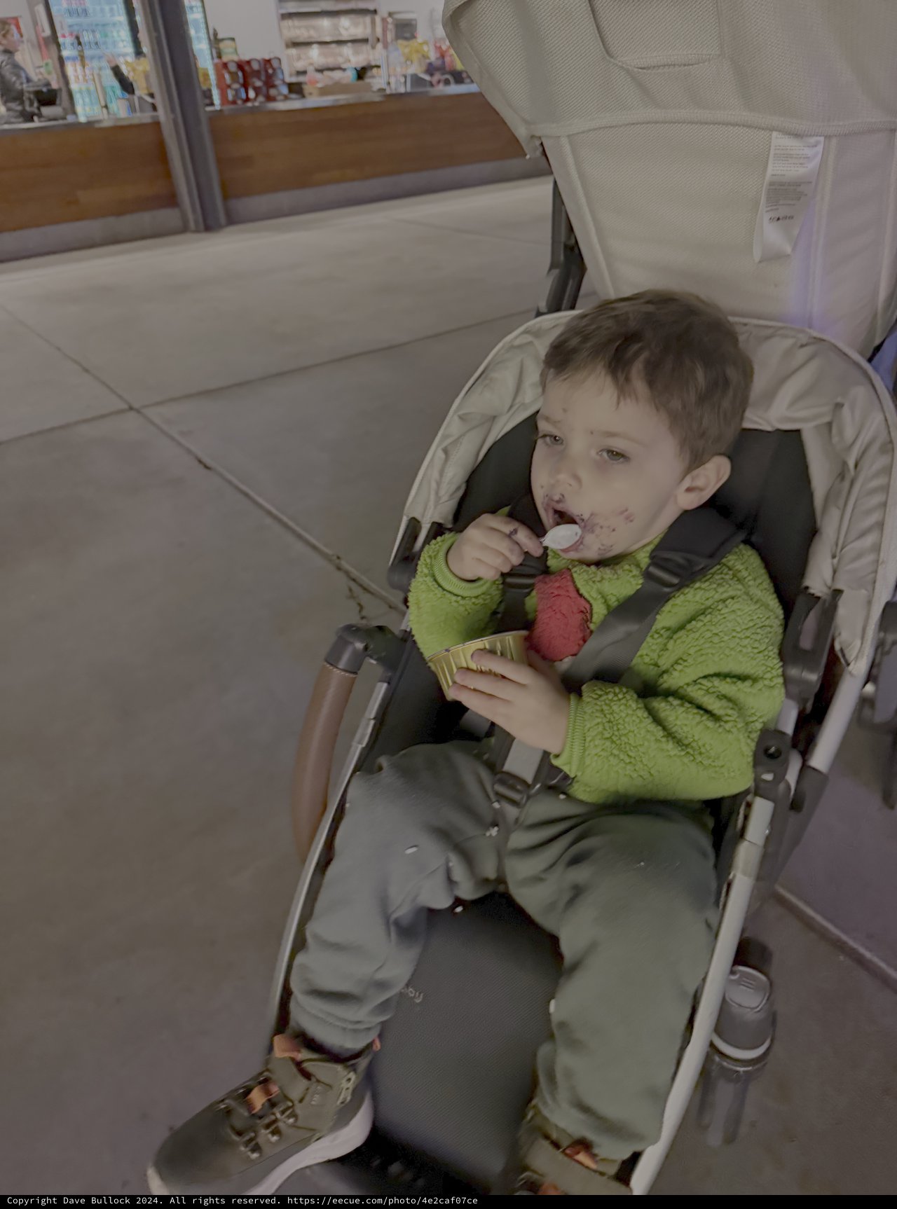 Young Child Enjoying Ice Cream in Stroller