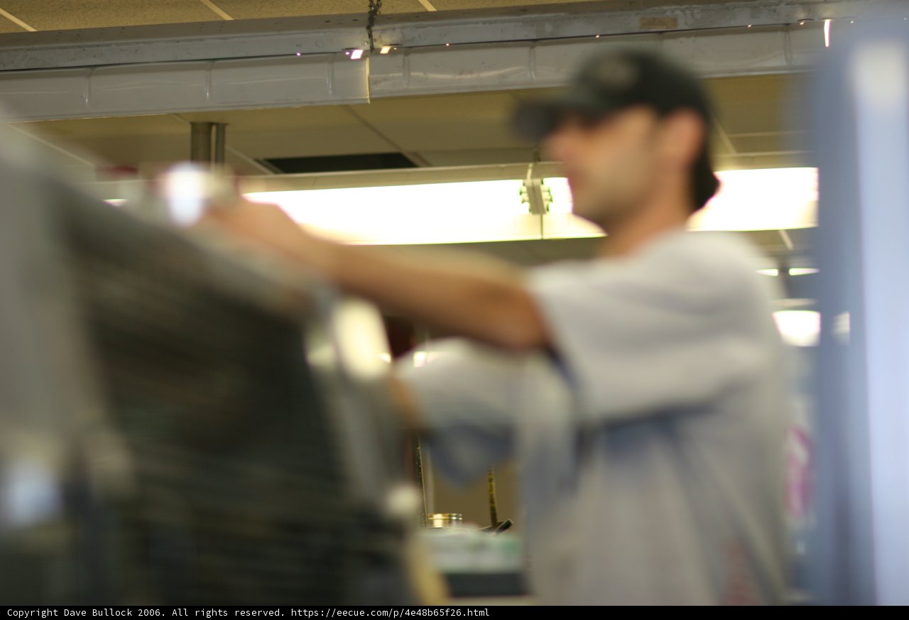 A Man Cooking in the Office Kitchen