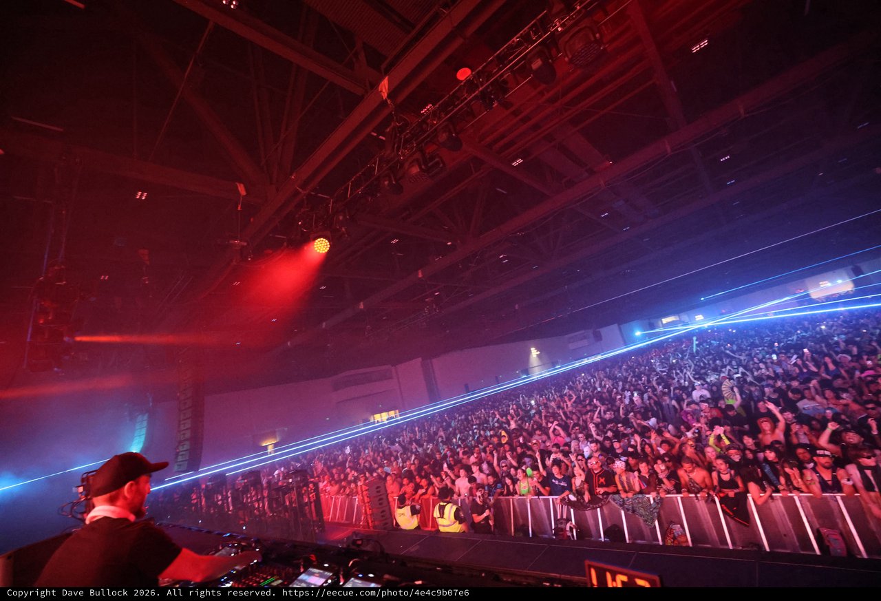 Massive Crowd Ignites Under Laser Light Storm