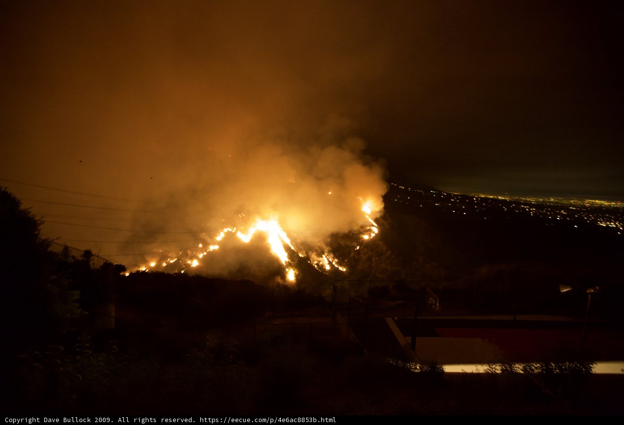 Flames engulf the night sky