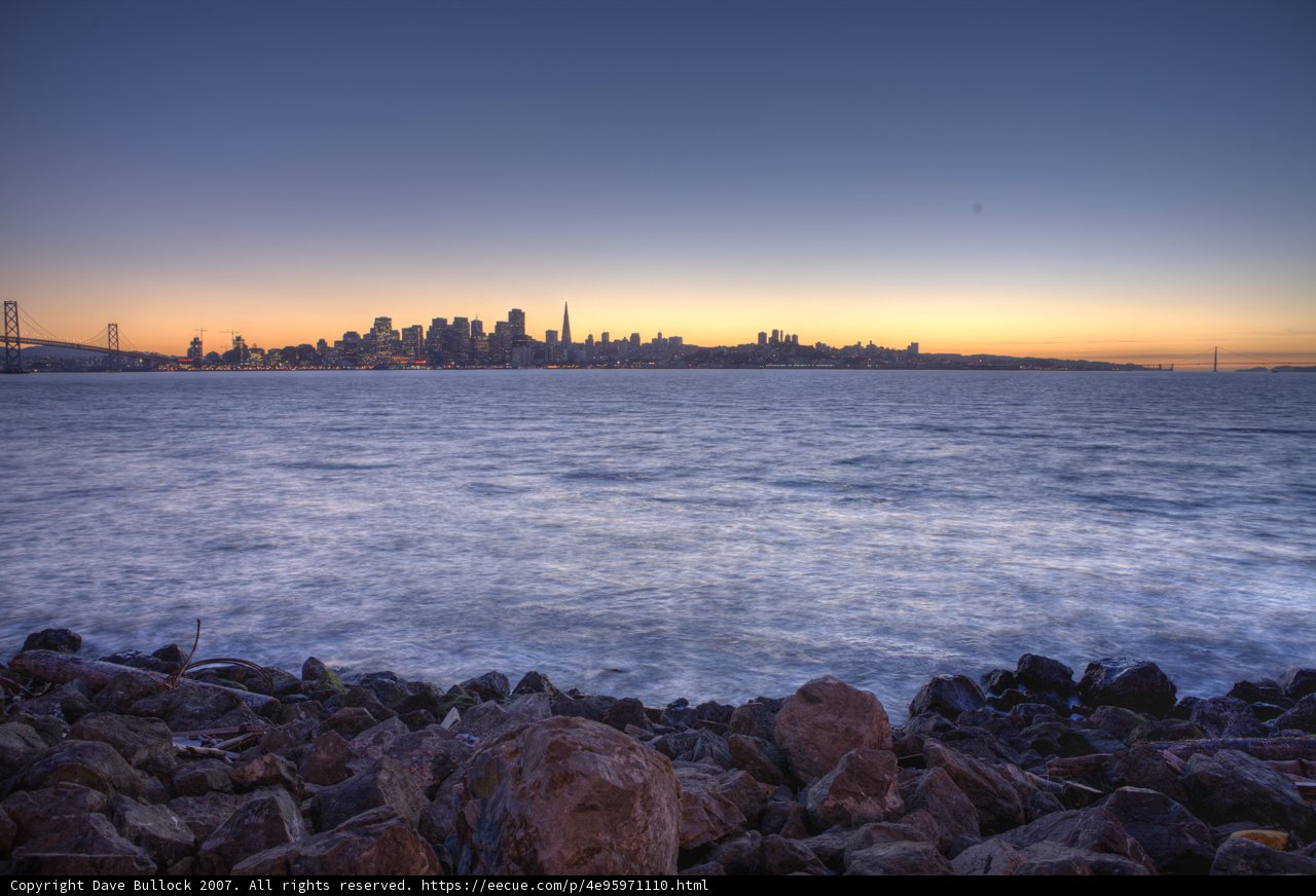 Shimmering Skyline on a Rocky Shoreline