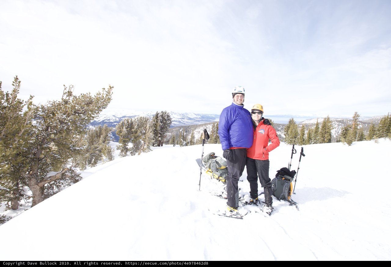 Couple Poses at Snowy Lake Tahoe Summit