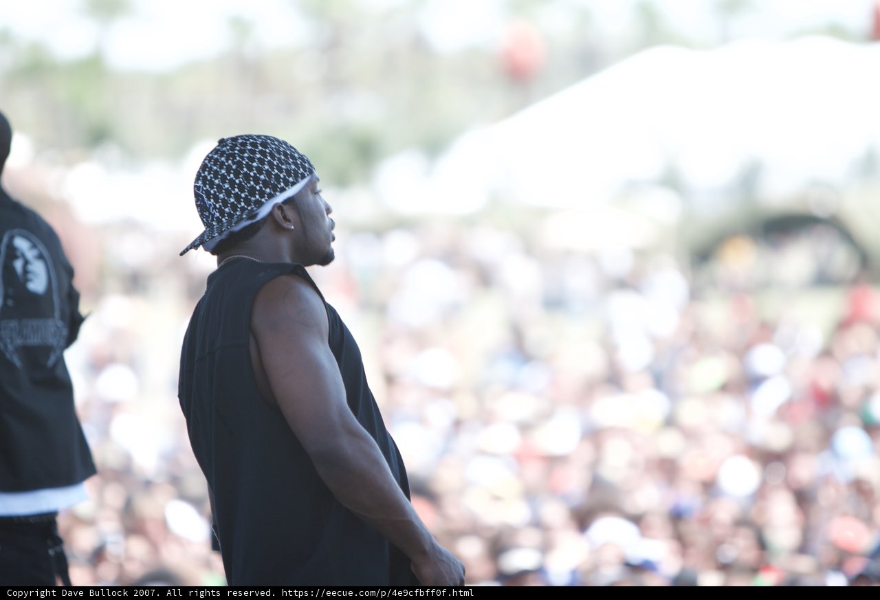 Bandana-wearing man in a sea of baseball caps