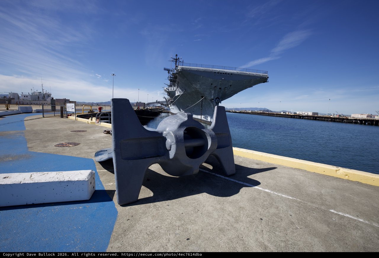 Naval Anchor and Aircraft Carrier at Harbor