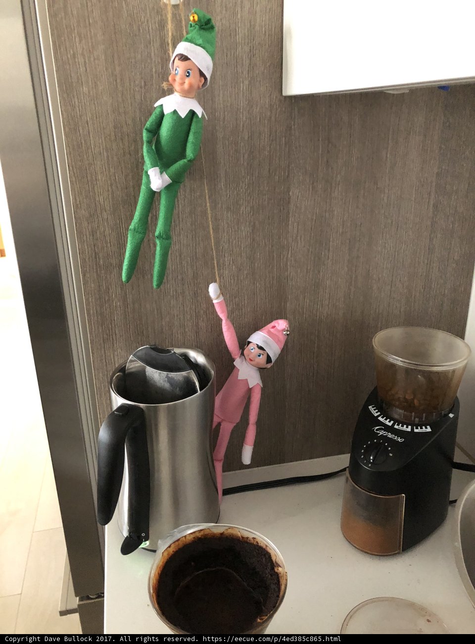 Elf Dolls Perched on a Coffee Maker