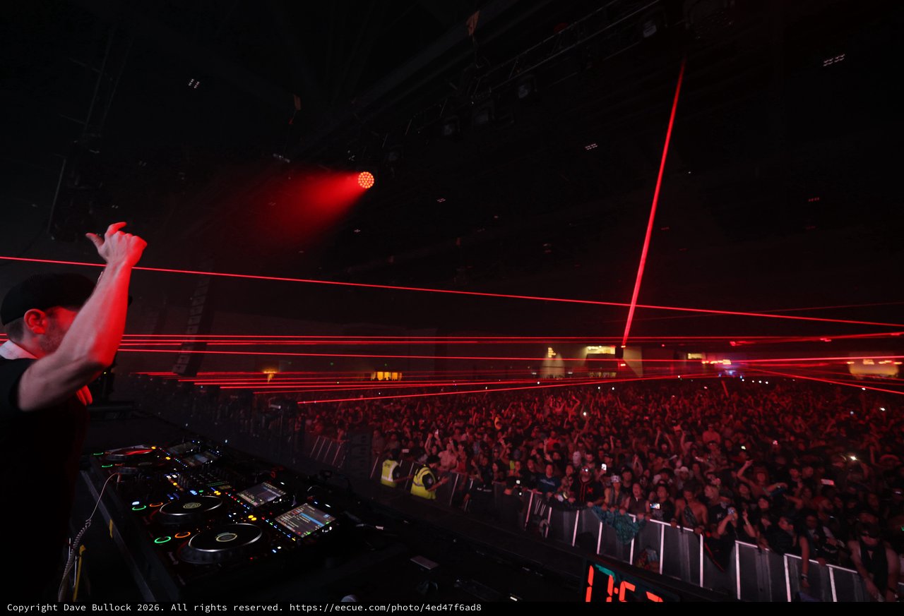DJ Ignites the Crowd with Blazing Red Lasers