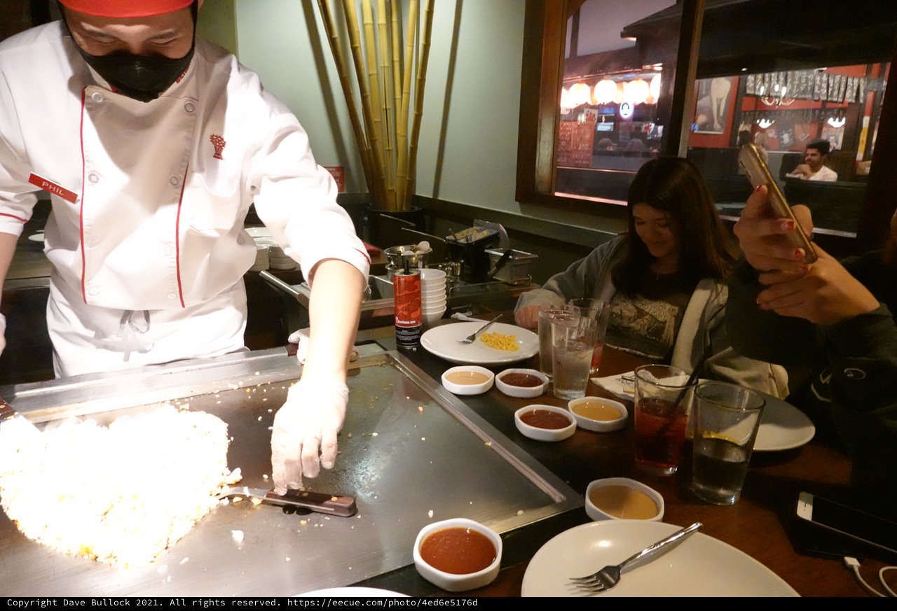 Hibachi Chef Cooking for Diners at Teppanyaki Restaurant